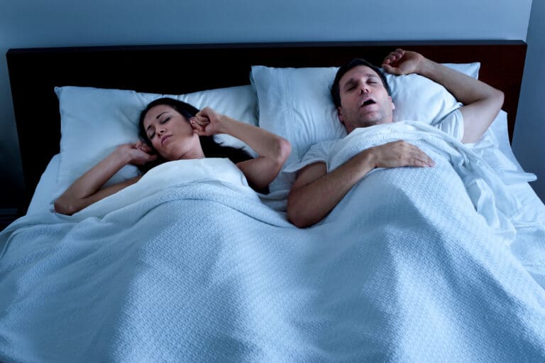 sleep apnea Snoring Man in Bed with Wife