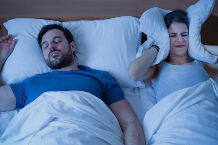 sleep divorce Man snoring in the bed